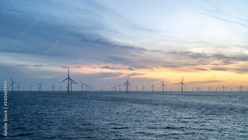 Different aspects of wonderful sunset offshore wind farm. - obrazy, fototapety, plakaty 