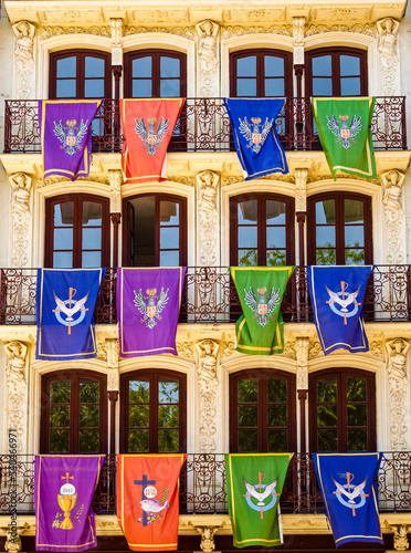 Historical banners on buildings during Corpus Christi in Toledo, Spain photo