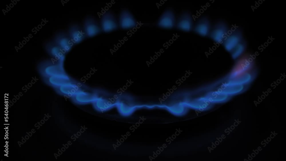 Gas burns with blue flames. Gas crisis around the world. Selective focus on the flame. Soft focus on the picture. Natural gas for housing Gas burns with blue flames. Gas crisis around the world. Selective focus on the flame. Soft focus on the picture. Natural gas for housing