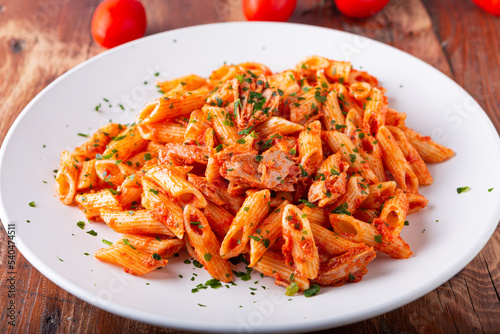 Pasta with tuna in tomato sauce, typical food of Mediterranean Italian cuisine.