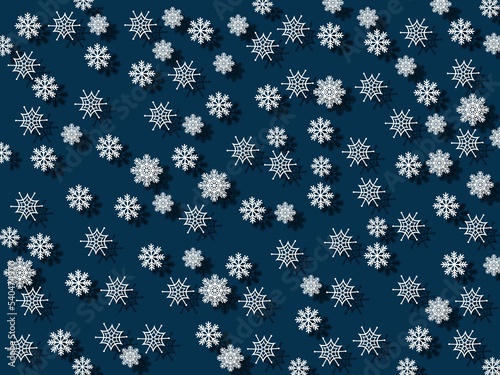 Falling white snowflakes on a blue background. New year and christmas concept.