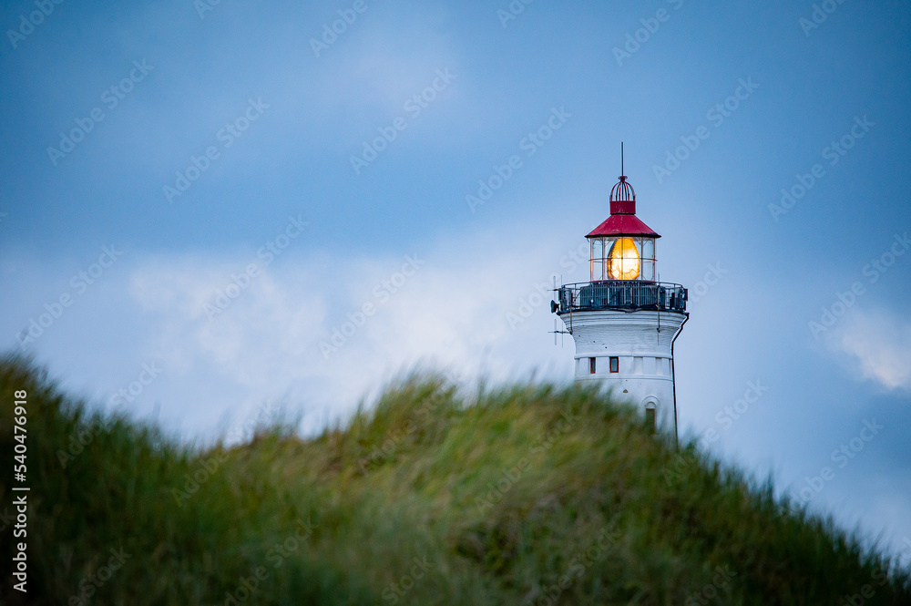 Nørre Lyngvig lighthouse behind a dune