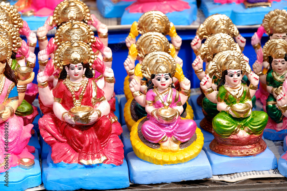 Beautiful statues of godess Lakshmi displayed for sale during festival of Diwali in Pune, India. Handcrafted Laxmi idols.