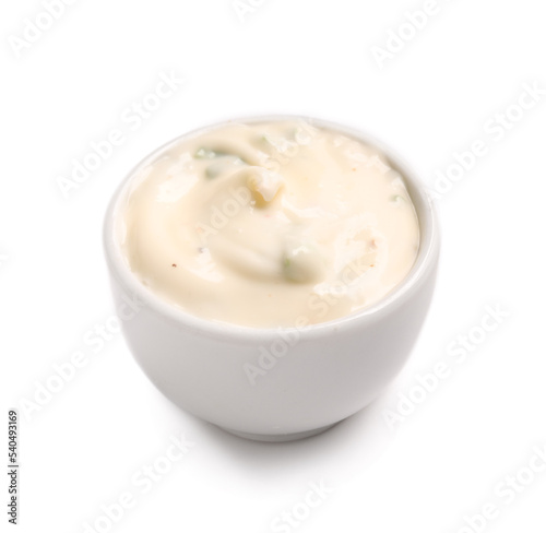 Sauce bowl with Caesar salad dressing on white background