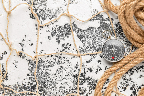 Vintage compass, rope and f...