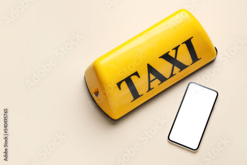 Yellow taxi roof sign and m...