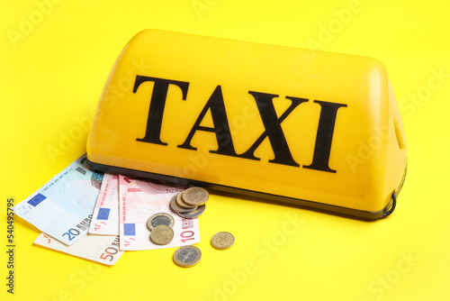 Taxi roof sign, coins and E...