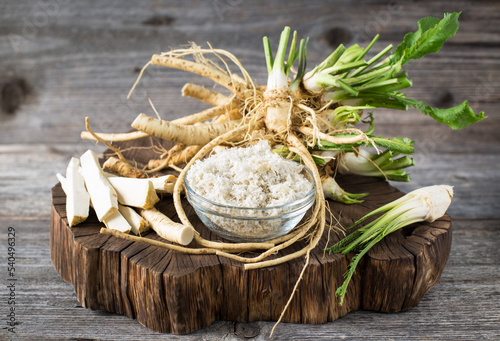 Obraz na płótnie Fresh organic horseradishes on the wooden table