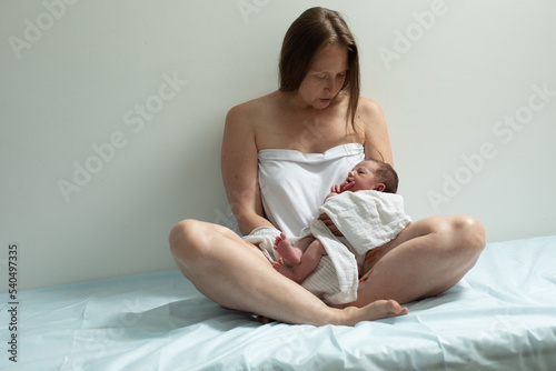 Woman with new born baby have a rest