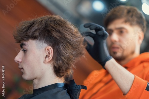 Young Caucasian boy getting a fresh haircut photo
