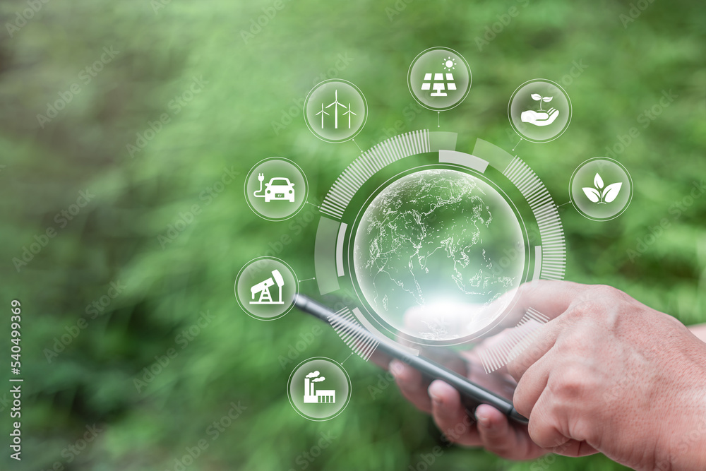Human hand holding smartphone and green earth ESG icon environmental ...