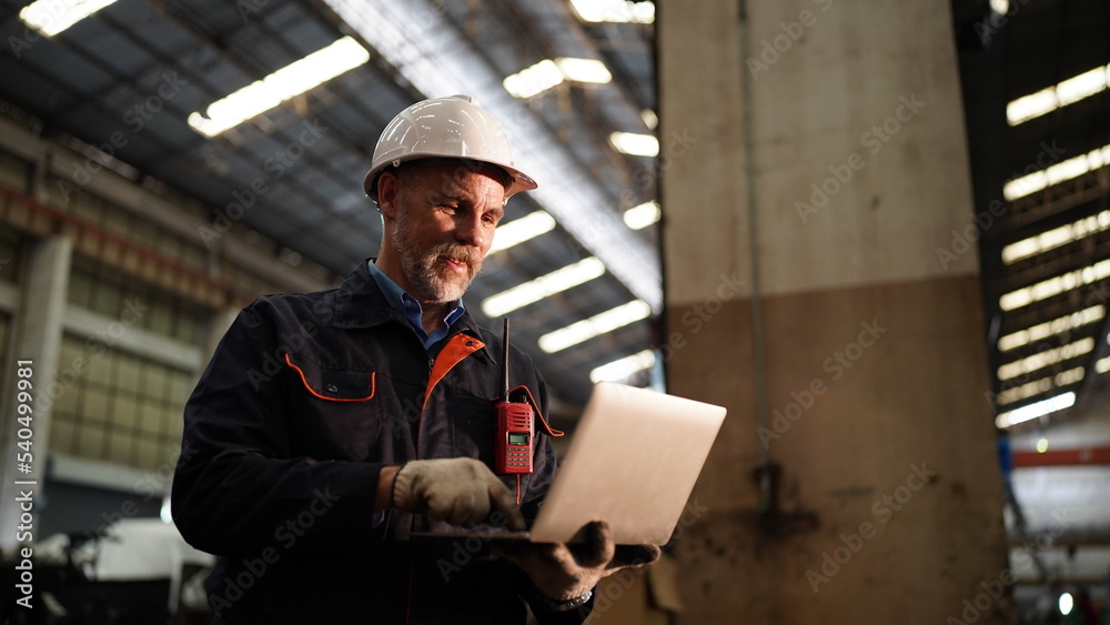 Factory engineer or foreman worker maintaining check equipment parts in factory. Factory engineer or foreman worker maintaining check equipment parts in factory.