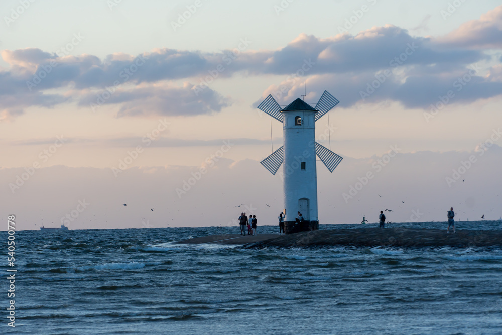 Windmill on the coast at sunset in Świnoujście.
Poland, See, Sommer 2022