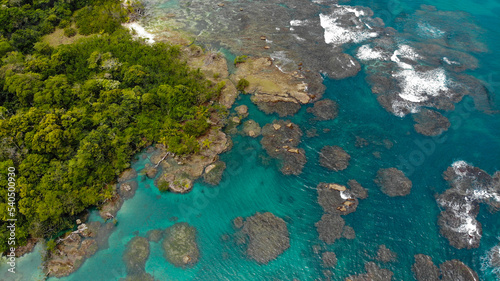 Tropical island  sea landscape. Stone beach on the island  aerial view 