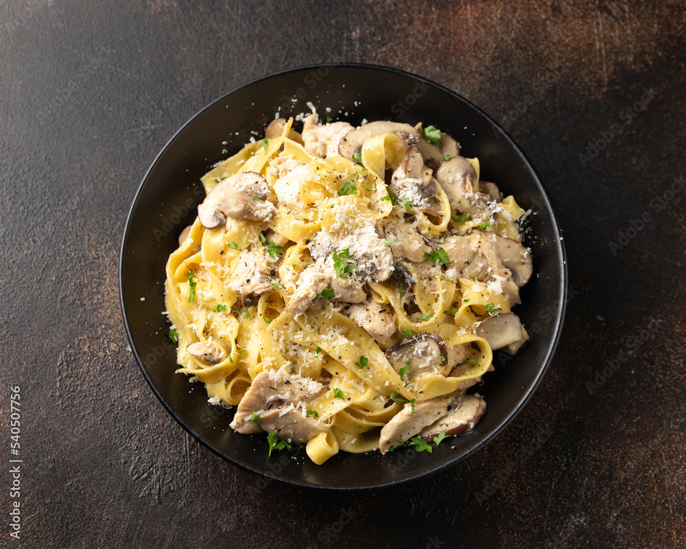Creamy Alfredo pasta with chicken, mushrooms and parmesan cheese. Healthy Italian food Creamy Alfredo pasta with chicken, mushrooms and parmesan cheese. Healthy Italian food