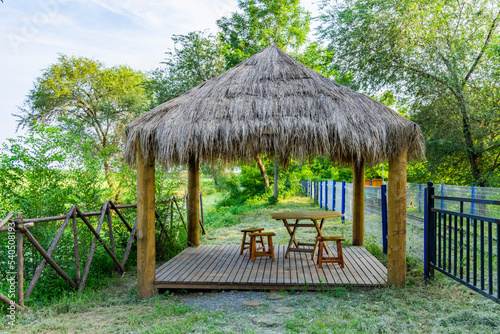 A pavilion and tables and chairs in the Xiqing Country Park in Tianjin photo