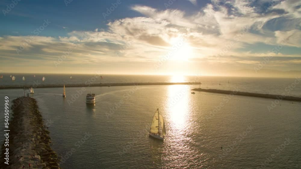 Aerial Time Lapse Shot Of Yachts Moving On Rippled Sea Under Cloudy Sky At Sunset - Santa Monica, California Aerial Time Lapse Shot Of Yachts Moving On Rippled Sea Under Cloudy Sky At Sunset - Santa Monica, California