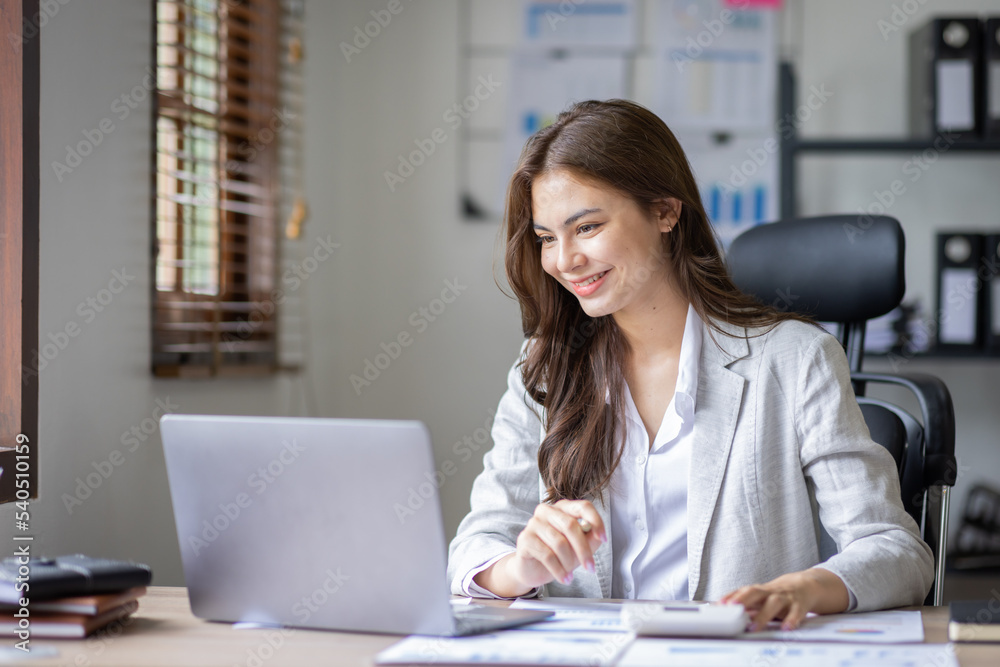 Young business multiethnic Asian women Accounting using calculating laptop income-expenditure and analyzing real estate investment data report Financial and tax systems in workplace office. Young business multiethnic Asian women Accounting using calculating laptop income-expenditure and analyzing real estate investment data report Financial and tax systems in workplace office.