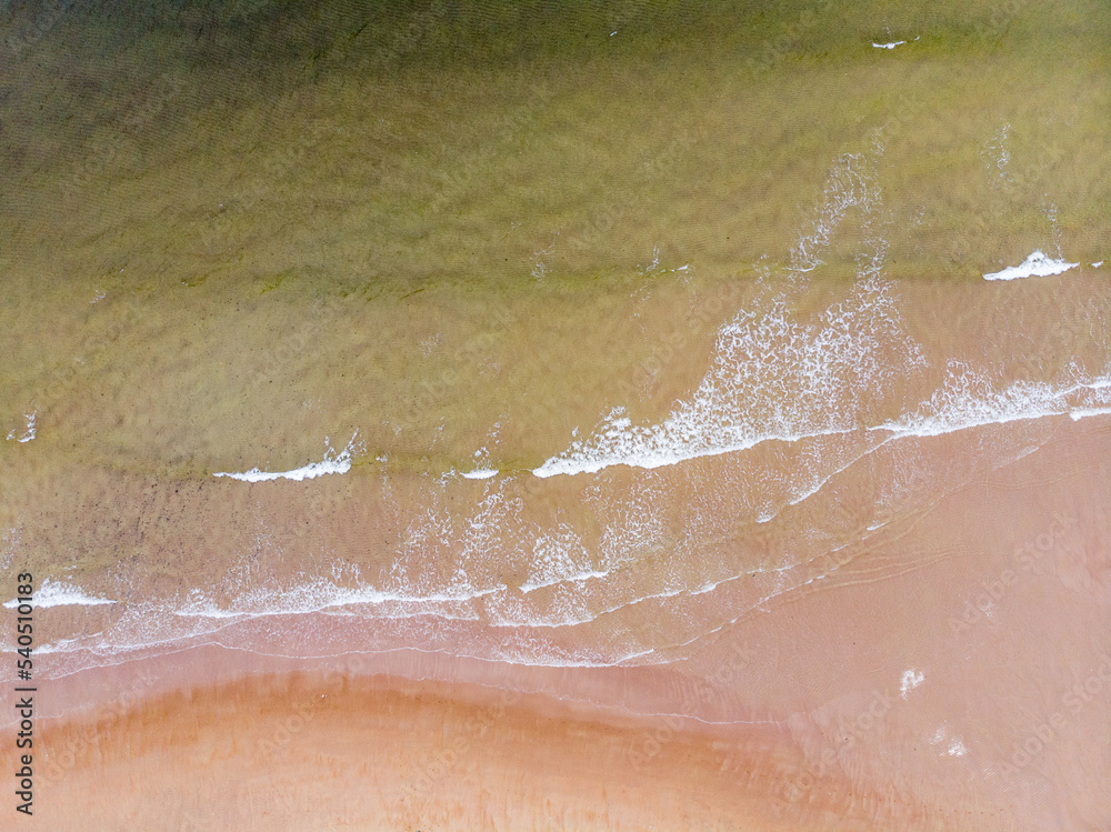 Fototapeta premium Surf line on the sandy beach of the Barents Sea. Teriberka