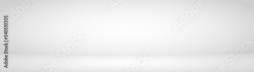 Abstract background. The studio space is empty. With a smooth and soft white and gray color	