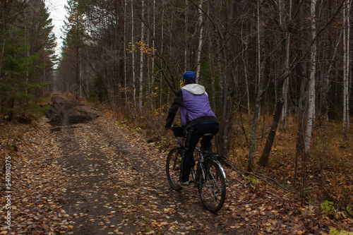 Cycling through the autumn forest. October 2022