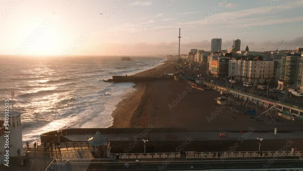 Beautiful Brighton beach 4k video. Magical sunset and stormy weather in Brighton, UK. Town by the ocean.