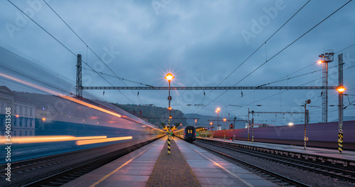 Decin station on platform in blue dark cloudy evening