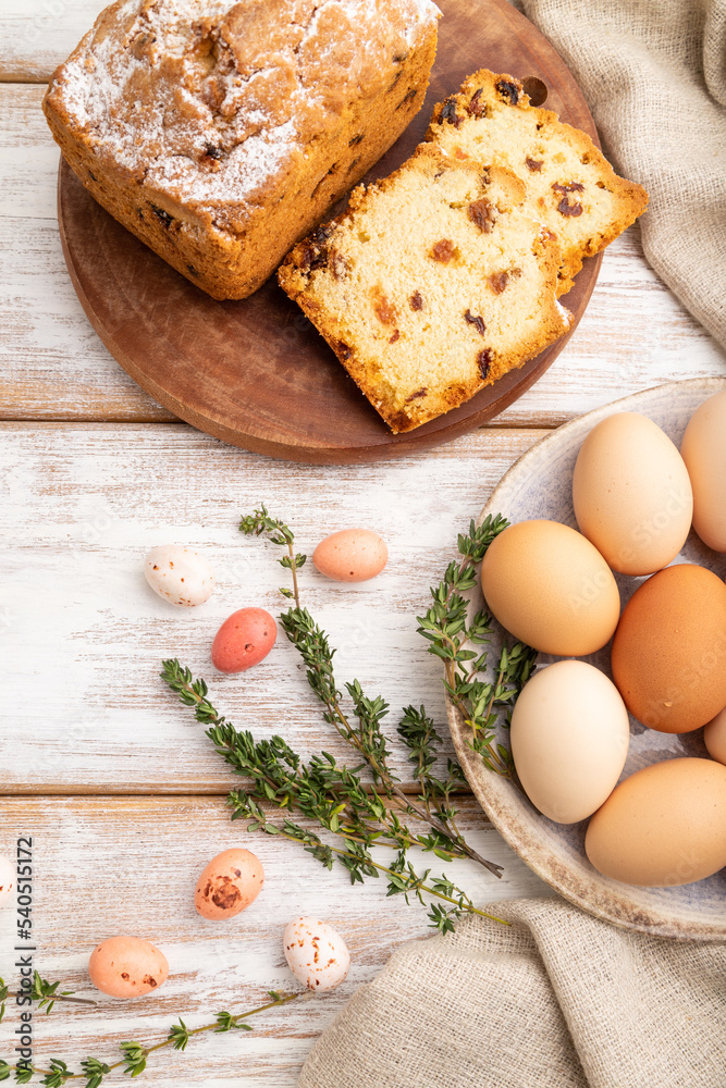 Homemade easter pie with raisins and eggs on plate on a white wooden background. top view, close up. Homemade easter pie with raisins and eggs on plate on a white wooden background. top view, close up.