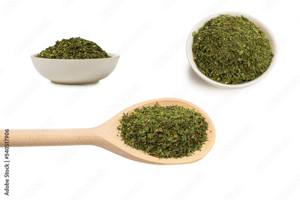 Dry mint in wooden spoon isolated on white. Dry mint in wooden spoon isolated on white.