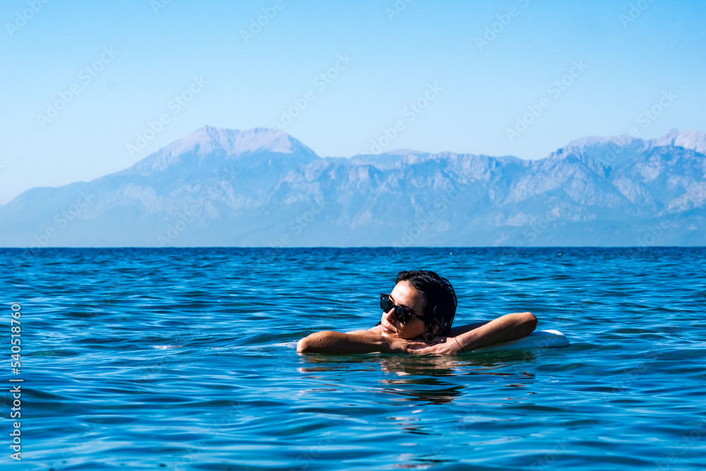 girl resting in the sea girl resting in the sea
