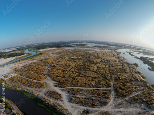 aerial view of wide catkin field and road pattens