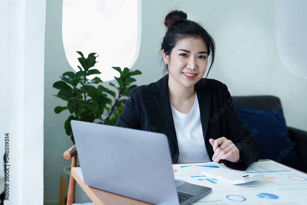 Accountants, Asian auditors are using calculators and computers to review annual tax budgets to submit information to the IRS. Accountants, Asian auditors are using calculators and computers to review annual tax budgets to submit information to the IRS.