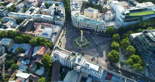 Aerial view of Freedom Square in Tbilisi, Georgia. Traffic of cars at the roundabout intersection. View from the height of the city. High quality 4k footage