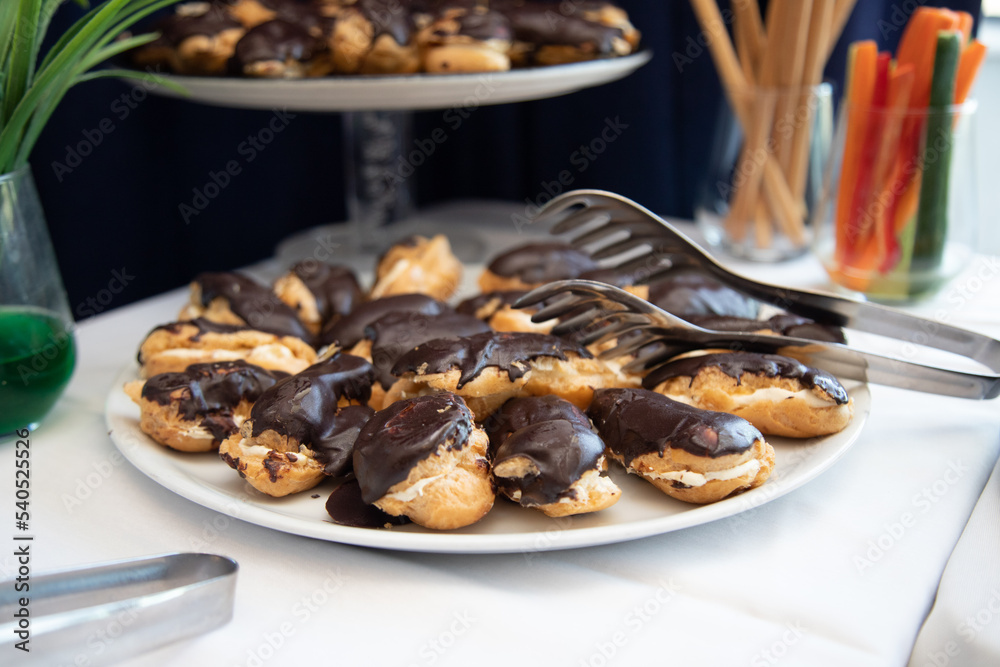 Banquet table with snacks, food on plates, festive table, corporate food Banquet table with snacks, food on plates, festive table, corporate food
