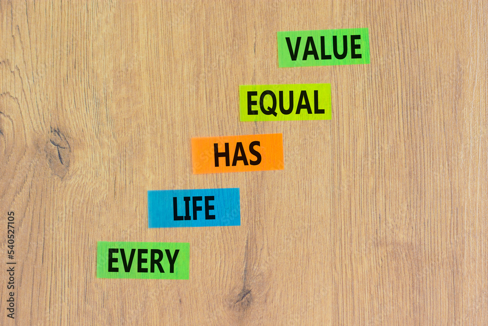 Every life has equal value symbol. Concept words Every life has equal value on colored paper. Beautiful wooden background. Business and every life has equal value concept. Copy space. Every life has equal value symbol. Concept words Every life has equal value on colored paper. Beautiful wooden background. Business and every life has equal value concept. Copy space.