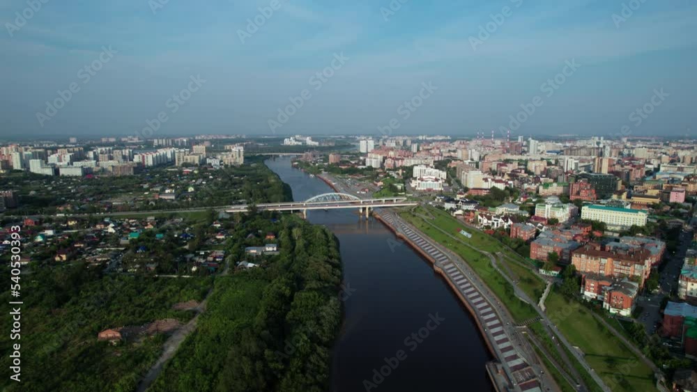 Tyumen, Russia - July 25 2022: City, river and bridge Tyumen, Russia - July 25 2022: City, river and bridge
