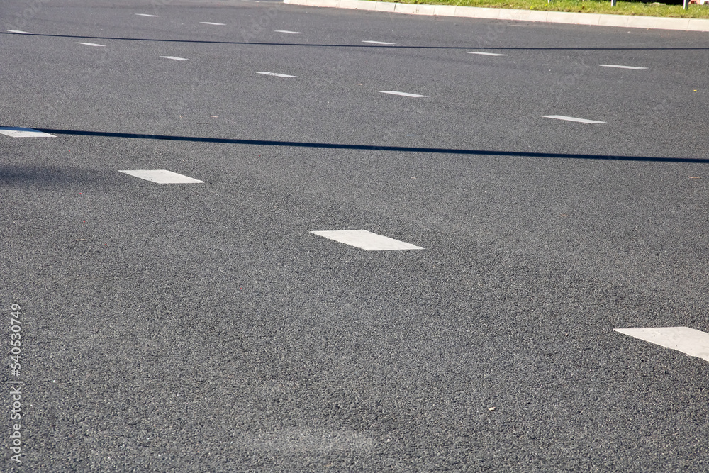Dividing strip on a wide road closeup Dividing strip on a wide road closeup