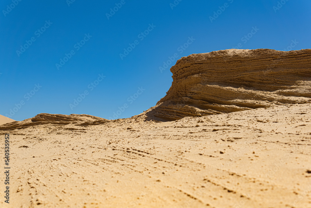 desert landscape, layered sandstone rock