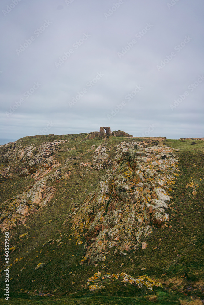 Fototapeta premium Beautiful trail seaside views in Jersey Island (Channel islands) on cold cloudy day