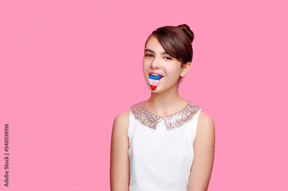 Brunette girl showing her tongue with a french flag on it Brunette girl showing her tongue with a french flag on it