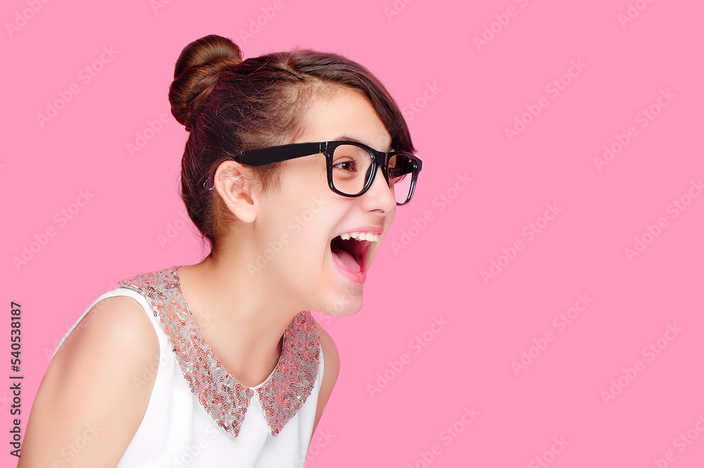 Closeup side view portrait of a screaming girl Closeup side view portrait of a screaming girl