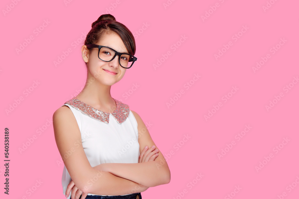 Confident smiling school girl with crossed hands Confident smiling school girl with crossed hands