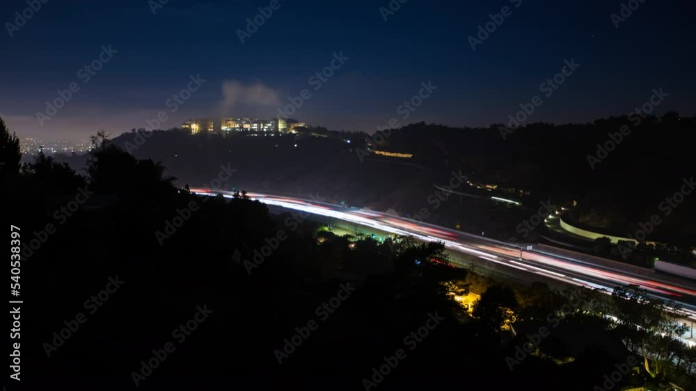 Aerial Panning Time Lapse Shot Of Light Trail Of Vehicles Moving On City Road At Night - Santa Monica, California Aerial Panning Time Lapse Shot Of Light Trail Of Vehicles Moving On City Road At Night - Santa Monica, California