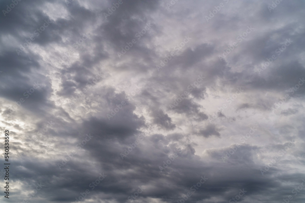 Gloomy sky with gray cumulus rain clouds during the day 10-12 hours in the middle latitudes.