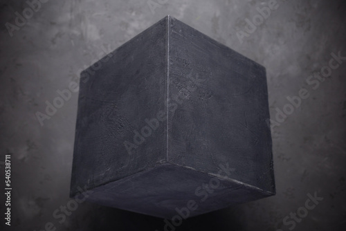 Concrete cube shape on floor background texture. Cement block as abstract concept