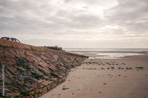 Beautiful beaches of Jersey Island (Channel Isnads, UK) on cluody cold day photo