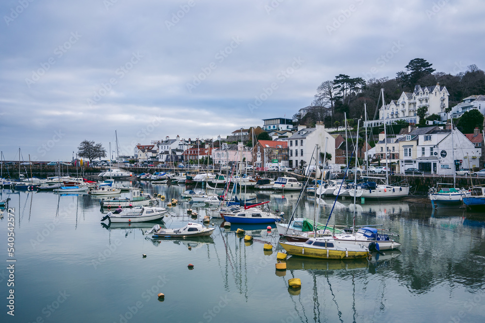 Boats moored at low tide at the St Aubin marina
