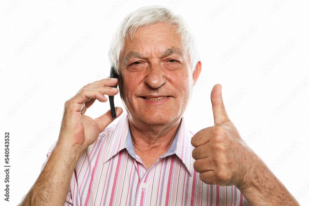 Portrait of positive old man hold new cellphone show okay sign Portrait of positive old man hold new cellphone show okay sign