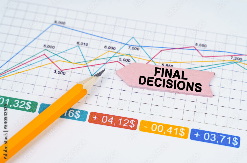 On business charts there is a pencil and an arrow sticker with the inscription - Final Decisions On business charts there is a pencil and an arrow sticker with the inscription - Final Decisions