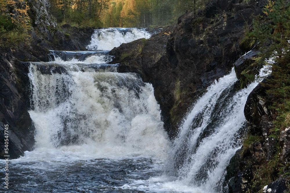 Stormy stream of Kivach waterfall in autumn Karelia Stormy stream of Kivach waterfall in autumn Karelia